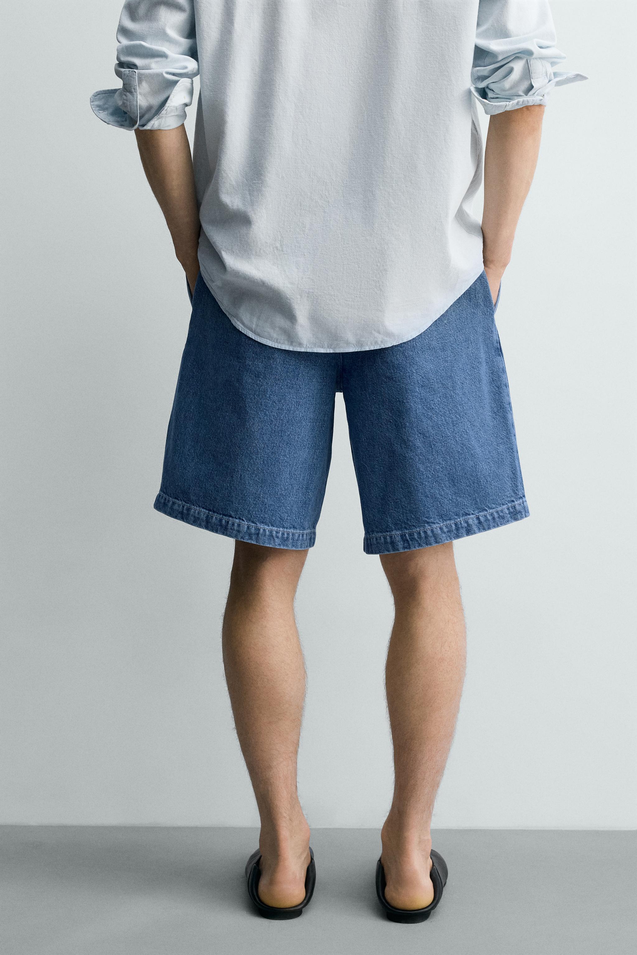 RELAXED FIT PLEATED DENIM SHORTS